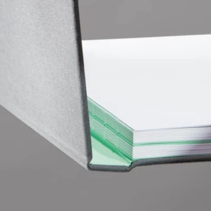 Charcoal Grey Hardcover Notebook. Binding. Side shot of the Swiss-bound Charcoal Grey notebook.