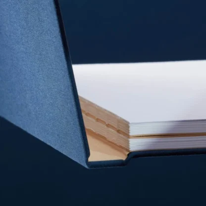 Midnight Blue Hardcover Notebook. Binding. Side shot of the Swiss-bound midnight blue notebook.